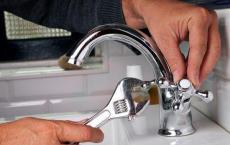 Housework: installing a faucet on a sink